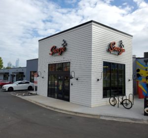 An Exterior Photo Of The Snooze Restaurant In Charlotte Showing The Snooze Sign