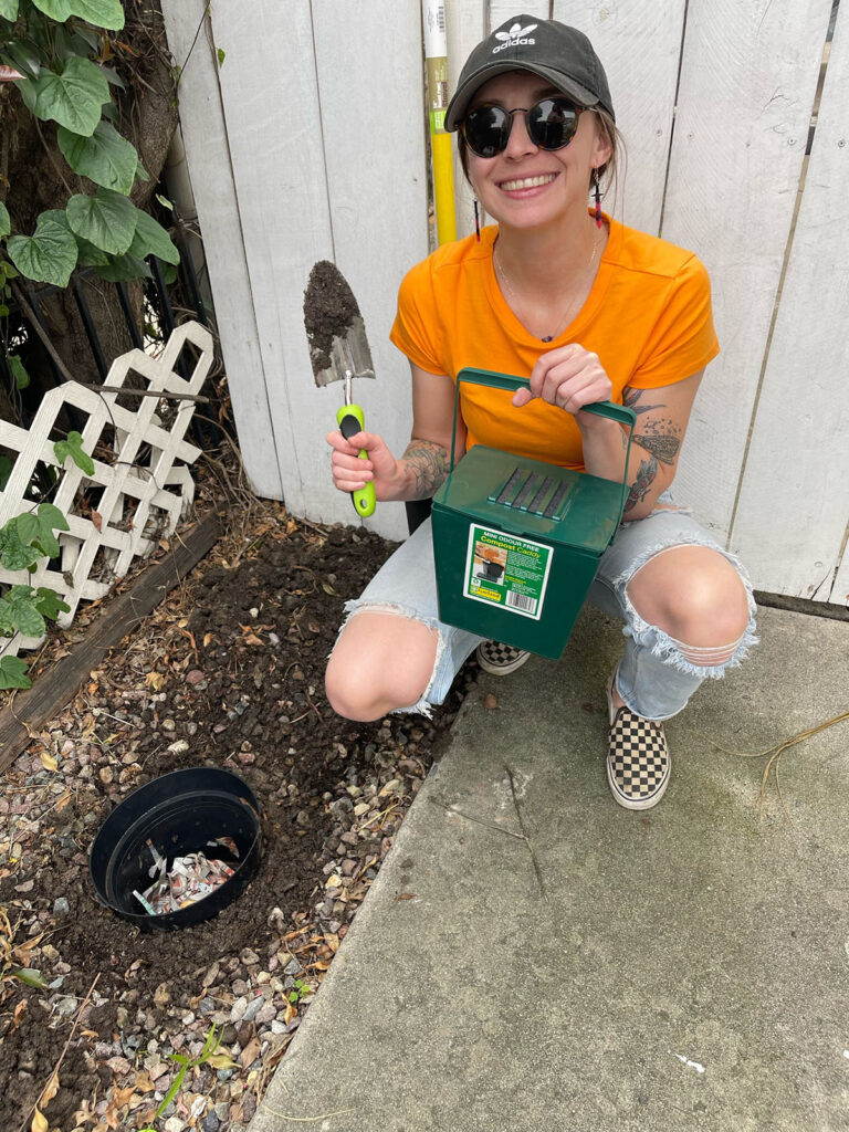 Snooze Changemaker Bria holding compost bucket