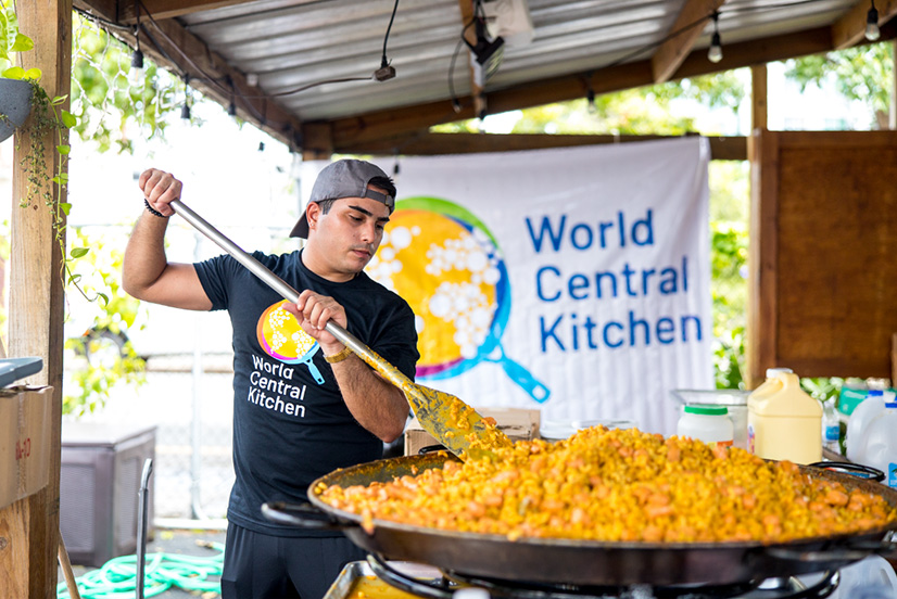 World Central Kitchen employee stirring food